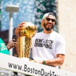 Jayson Tatum celebrates during a duck boat parade to celebrate the 18th Boston Celtics NBA championship on Friday, June 21, 2024. The Celtics defeated the Dallas Mavericks in Game 5 of the NBA Finals.