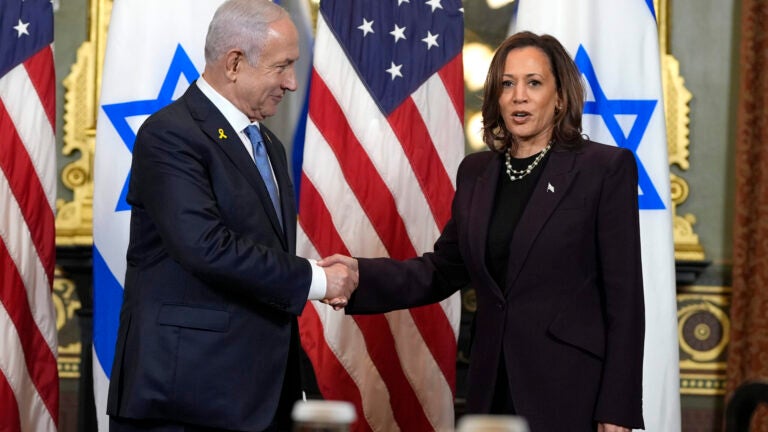 FILE - Vice President Kamala Harris, right, shakes hands with Israeli Prime Minister Benjamin Netanyahu in Washington, July 25, 2024. Just days after launching her White House campaign, Harris tiptoed along one of the most divisive fault lines in Democratic politics on Thursday as she met with Netanyahu.