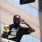 Jaylen Brown celebrates during a duck boat parade to celebrate the 18th Boston Celtics NBA championship on Friday, June 21, 2024. The Celtics defeated the Dallas Mavericks in Game 5 of the NBA Finals.