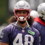 Jahlani Tavai warming up prior to a Patriots minicamp practice in June.