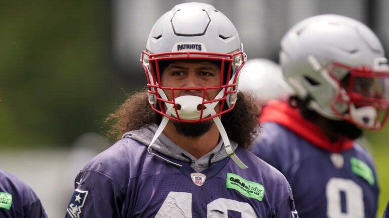 Jahlani Tavai warming up prior to a Patriots minicamp practice in June.