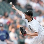 Chicago White Sox starting pitcher Erick Fedde delivers during the first inning of a baseball game against the Seattle Mariners.