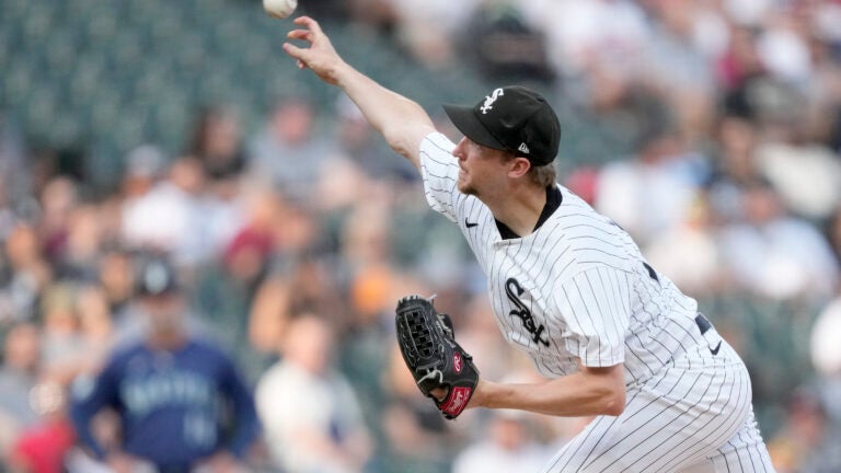 Chicago White Sox starting pitcher Erick Fedde delivers during the first inning of a baseball game against the Seattle Mariners.