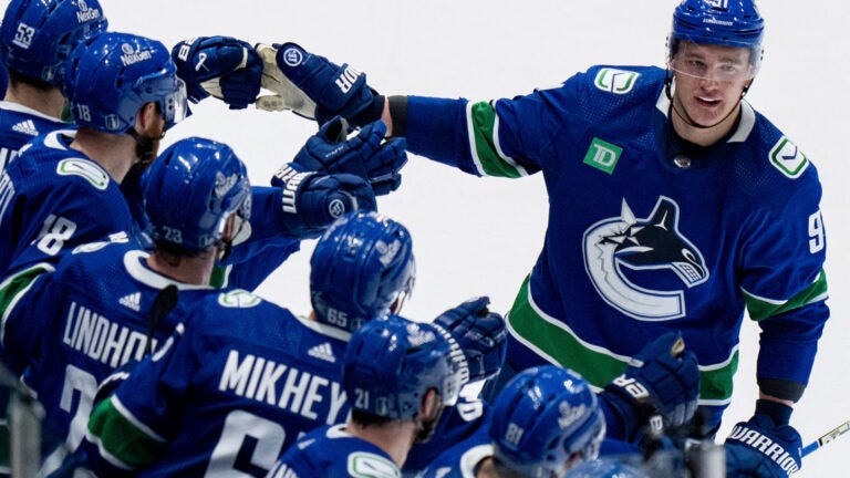 Vancouver Canucks' Nikita Zadorov is congratulated for his goal against the Edmonton Oilers during the second period of Game 2 of an NHL hockey Stanley Cup second-round playoff series, Friday, May 10, 2024, in Vancouver, British Columbia.