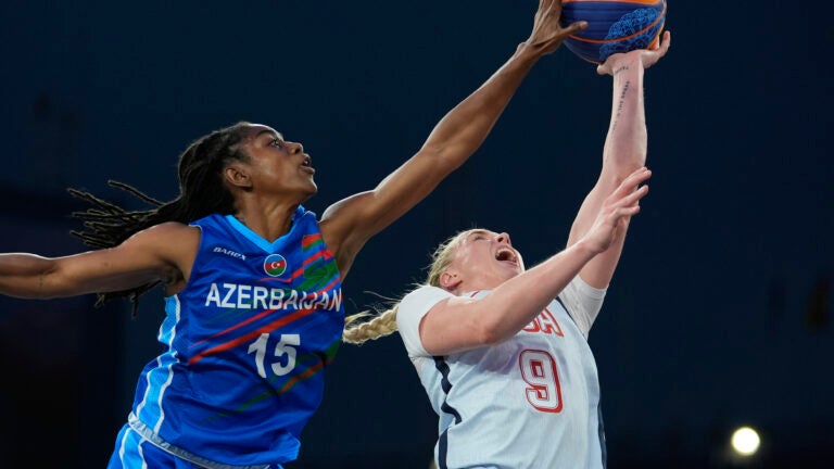 Azerbaijan's Tiffany Hayes defends against a shot by Hailey van Lith of the United States in the women's 3x3 basketball pool round match between the United States and Azerbaijan at the 2024 Summer Olympics.