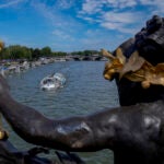 A tourist boat makes its way along the Seine River by the Alexandre III bridge, at the 2024 Summer Olympics.