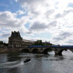 A bomb squad boat navigates the Seine River as officials prepare for Friday's opening ceremony ahead of the 2024 Summer Olympics.