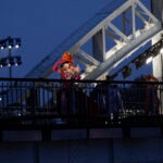 Drag queens prepare to perform on the Debilly Bridge in Paris, during the opening ceremony of the 2024 Summer Olympics.