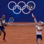 Coco Gauff and Jessica Pegula of the United States play Linda Noskova and Karolina Muchova of the Czech Republic during their women's doubles match, at the 2024 Summer Olympics.