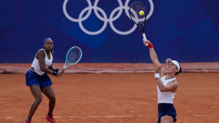 Coco Gauff and Jessica Pegula of the United States play Linda Noskova and Karolina Muchova of the Czech Republic during their women's doubles match, at the 2024 Summer Olympics.