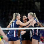 Avery Skinner of the United States celebrates with teammates after setting a point during the group A women's volleyball match between the United States and China at the 2024 Summer Olympics.