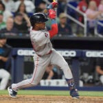 Ceddanne Rafaela of the Red Sox hits a double during the ninth inning.