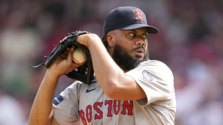 Boston Red Sox pitcher Kenley Jansen looks to throw during a baseball game against the Cincinnati Reds in Cincinnati, Sunday, June 23, 2024.