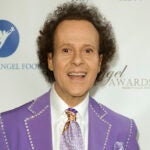 FILE - Richard Simmons arrives at the Project Angel Food's 2013 Angel Awards in Los Angeles on Aug. 10, 2013. Simmons, a fitness guru who urged the overweight to exercise and eat better, died Saturday, July 13, 2024, at the age of 76.