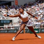 Coco Gauff of the U.S. plays a shot against Poland's Iga Swiatek during their semifinal match of the French Open tennis tournament at the Roland Garros stadium in Paris.