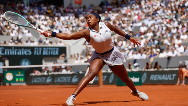 Coco Gauff of the U.S. plays a shot against Poland's Iga Swiatek during their semifinal match of the French Open tennis tournament at the Roland Garros stadium in Paris.