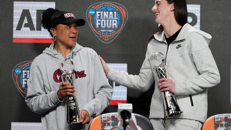 South Carolina head coach Dawn Staley (left) is part of the Olympic team selection committee, which left Caitlin Clark (right) off the roster.