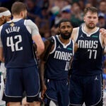 Dallas Mavericks guard Kyrie Irving (11) and Dallas Mavericks guard Luka Doncic (77) look on during the second quarter in Game 4 of the NBA Finals.