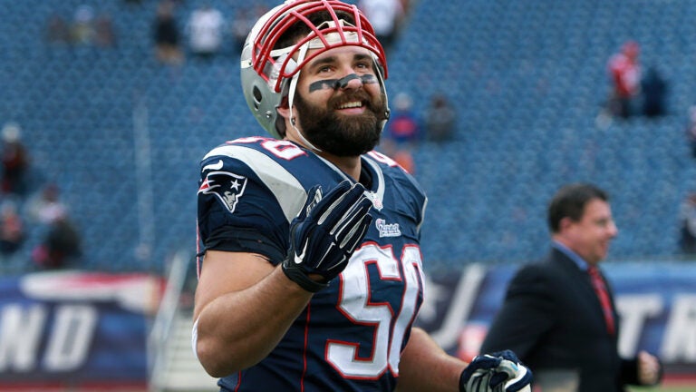 Patriots LB Rob Ninkovich smiles as he sees someone in the stands and blows them a kiss as he leaves the field following the New England victory. The New England Patriots hosted the Chicago Bears in a regular season NFL game at Gillette Stadium.