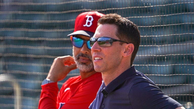 Boston Red Sox manager Alex Cora and Boston Red Sox Chief Baseball Officer Craig Breslow watch live batting practice. Boston Red Sox Spring Training.
