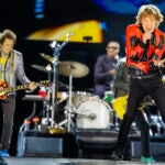 Mick Jagger lead singer for the Rolling Stones performs with his band at Gillette Stadium on May 30. In the background is Ron Wood and Steve Jordan.