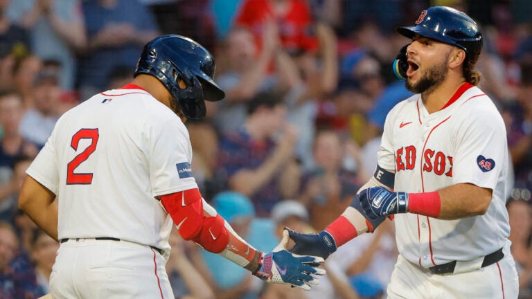 Wilyer Abreu celebrates his Thursday night home run with Dom Smith, part of the Red Sox finishing off a series win against the A's.