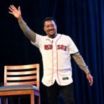 Former Red Sox pitcher Pedro Martinez waves and makes his entrance for a panel discussion on the 2004 World Series championship during the Red Sox Winter Weekend at MassMutual Center in Springfield.