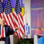 Former US President and 2024 Republican presidential nominee Donald Trump answers questions as moderator and journalist Rachel Scott (R) looks on during the National Association of Black Journalists annual convention in Chicago, Illinois, on July 31, 2024.