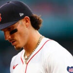 Boston Red Sox outfielder Jarren Duran (16) walks off the field in the third inning at Fenway Park.