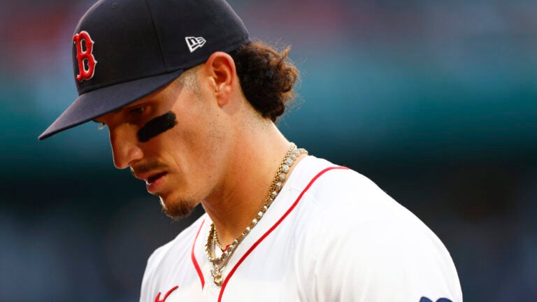 Boston Red Sox outfielder Jarren Duran (16) walks off the field in the third inning at Fenway Park.