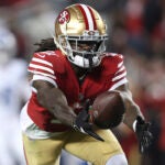 San Francisco 49ers wide receiver Brandon Aiyuk catches a pass against the Detroit Lions during the second half of the NFC Championship NFL football game in Santa Clara, Calif., Jan. 28, 2024. Aiyuk is staying away from the 49ers facility at the start of the offseason program as he seeks a lucrative long-term contract.