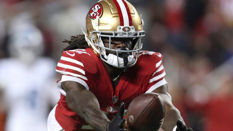San Francisco 49ers wide receiver Brandon Aiyuk catches a pass against the Detroit Lions during the second half of the NFC Championship NFL football game in Santa Clara, Calif., Jan. 28, 2024. Aiyuk is staying away from the 49ers facility at the start of the offseason program as he seeks a lucrative long-term contract.