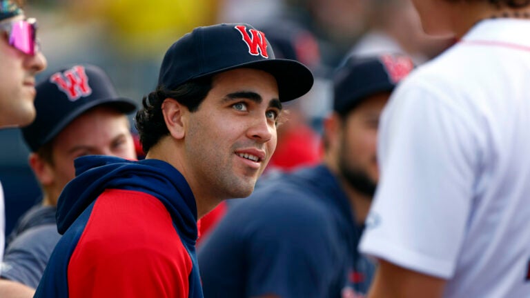 Worcester Red Sox infielder Marcelo Mayer sits in the dugout due to injury for his first game at Polar Park.