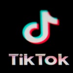 The icon for the video sharing TikTok app is seen on a smartphone.