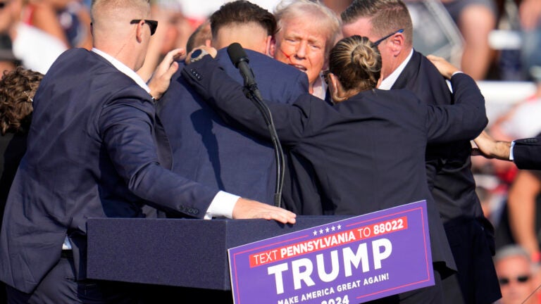 Republican presidential candidate former President Donald Trump is surrounded by Secret Service at a campaign event in Butler, Pa.