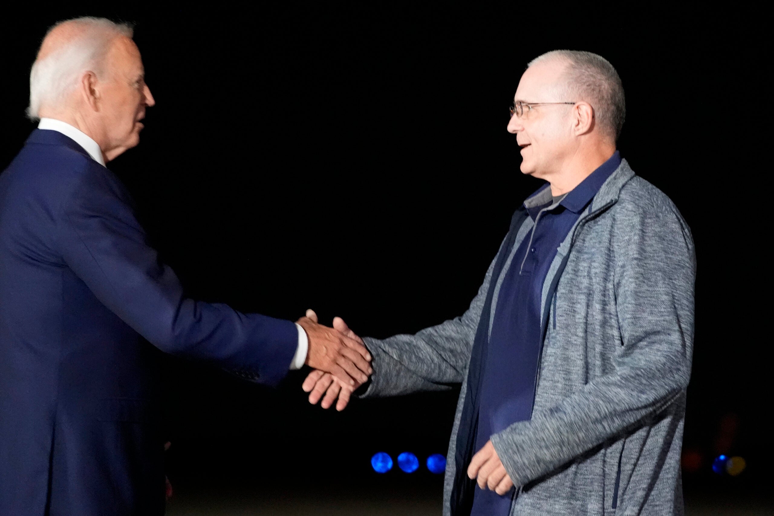 President Joe Biden, left, greets Paul Whelan at Andrews Air Force Base, Md.