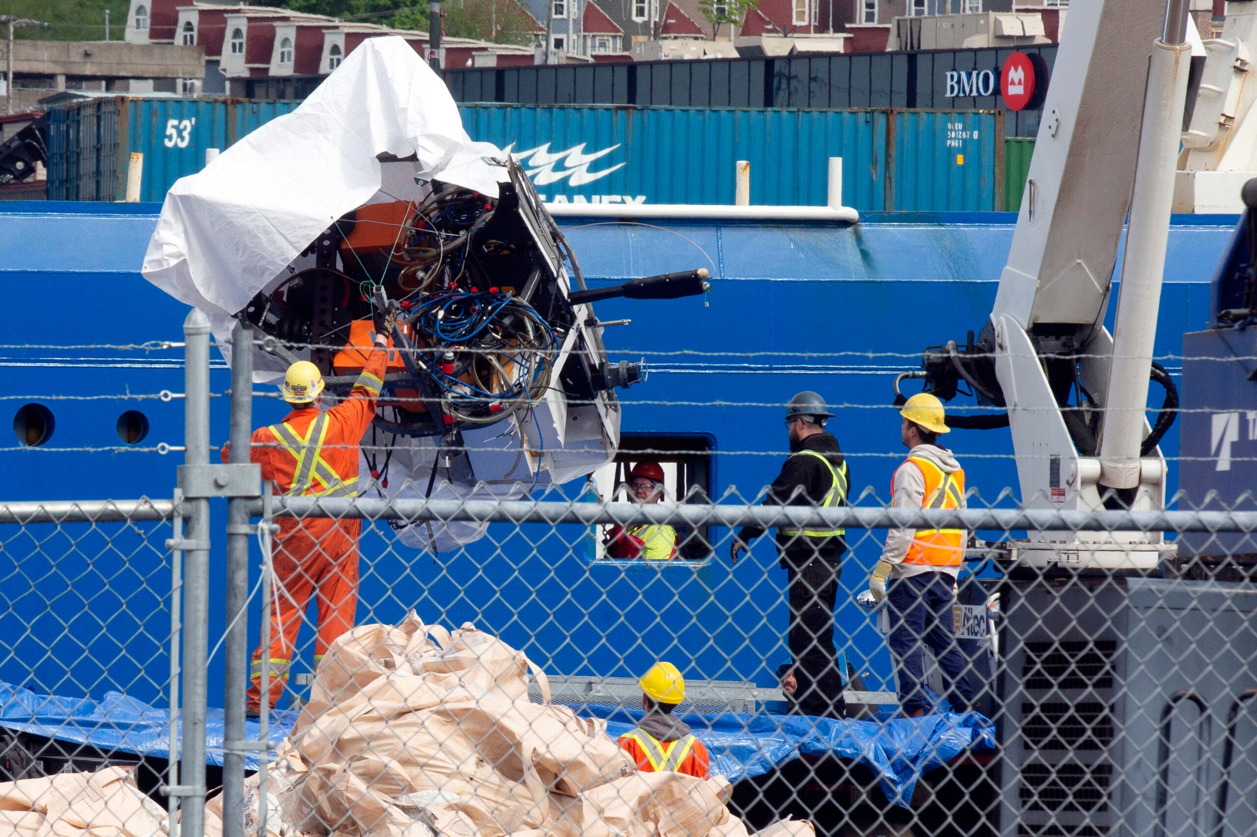 Debris from the Titan submersible, recovered from the ocean floor near the wreck of the Titanic, is unloaded from the ship Horizon Arctic at the Canadian Coast Guard pier in St. John's, Newfoundland.