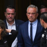 Independent presidential candidate Robert F. Kennedy Jr., center right, leaves the Albany County Courthouse.