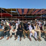 Afghans attend a ceremony to celebrate the third anniversary of the withdrawal of U.S.-led troops from Afghanistan.