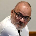 Victor Malavet looks behind him during his trial at Merrimack County Superior Court in Concord, N.H.