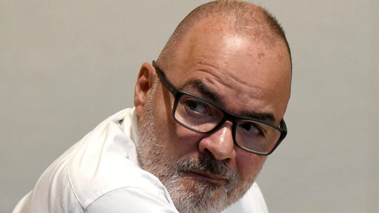 Victor Malavet looks behind him during his trial at Merrimack County Superior Court in Concord, N.H.