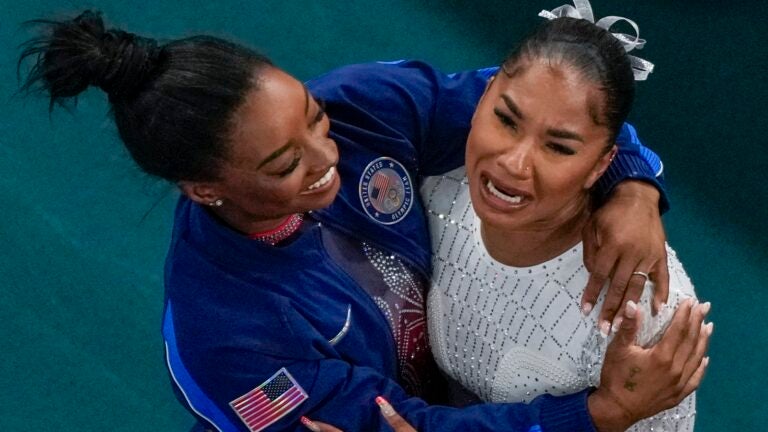 Jordan Chiles and Simone Biles celebrate after the women's artistic gymnastics individual floor finals in Bercy Arena.