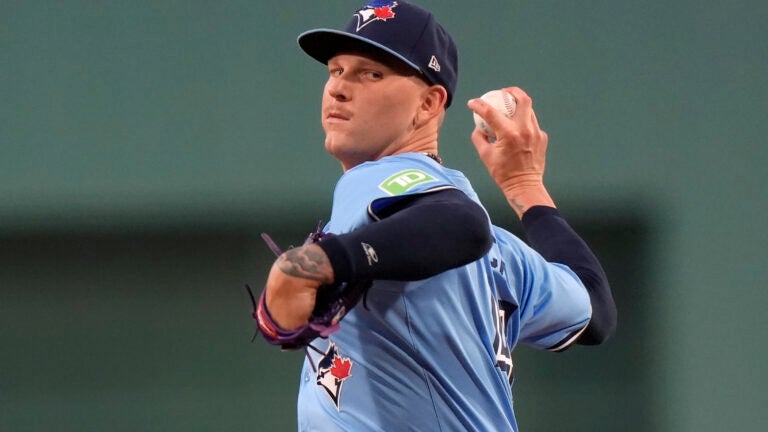 Blue Jays pitcher Bowden Francis winds up for a pitch in the first inning against the Red Sox.