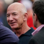 Amazon founder Jeff Bezos is seen on the sidelines before the start of an NFL football game between the Kansas City Chiefs and the Los Angeles Chargers Thursday, Sept. 15, 2022, in Kansas City, Mo.
