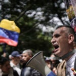 Demonstrators protest the Venezuela contested presidential election results outside Venezuela's consulate in Bogota, Colombia, Thursday, Aug. 1, 2024.