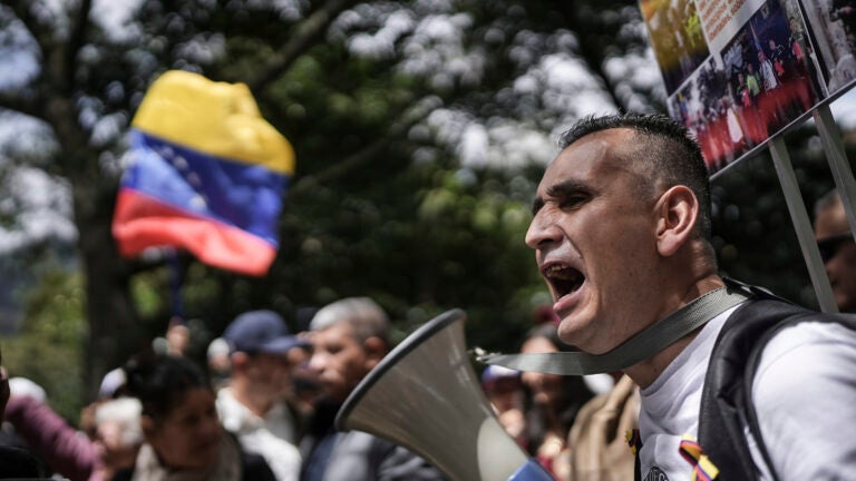 Demonstrators protest the Venezuela contested presidential election results outside Venezuela's consulate in Bogota, Colombia, Thursday, Aug. 1, 2024.