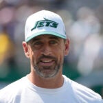 New York Jets quarterback Aaron Rodgers is seen before the start of an NFL preseason football game between the Washington Commanders and New York Jets.