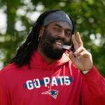 New England Patriots linebacker Matthew Judon walks onto the field during a joint NFL football practice with the Philadelphia Eagles, Tuesday, Aug. 13, 2024, in Foxborough, Mass.