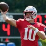 New England Patriots quarterback Drake Maye passes during a joint NFL football practice with the Philadelphia Eagles, Tuesday, Aug. 13, 2024, in Foxborough, Mass.