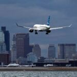 A JetBlue plane lands at Logan International Airport in Boston.